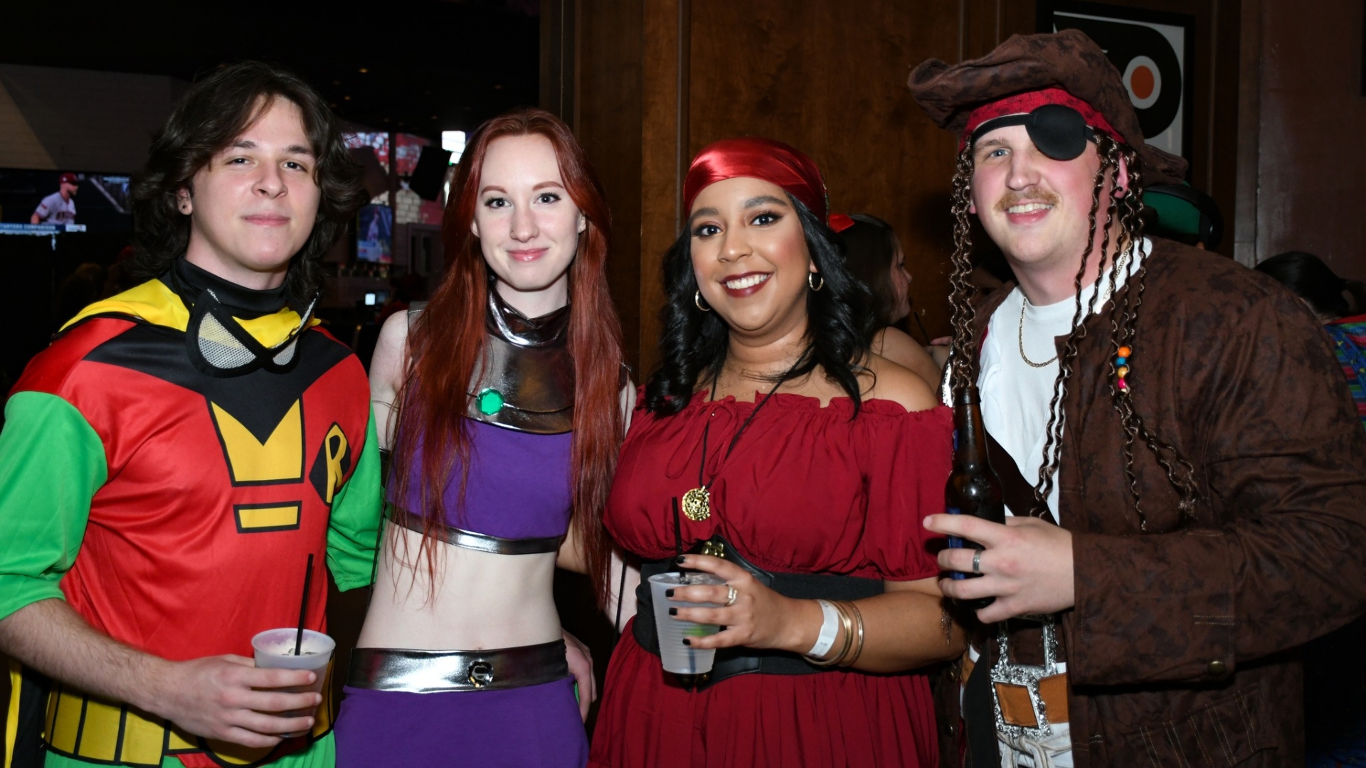 Two couples dressed in Halloween costumes for party at Xfinity Live!